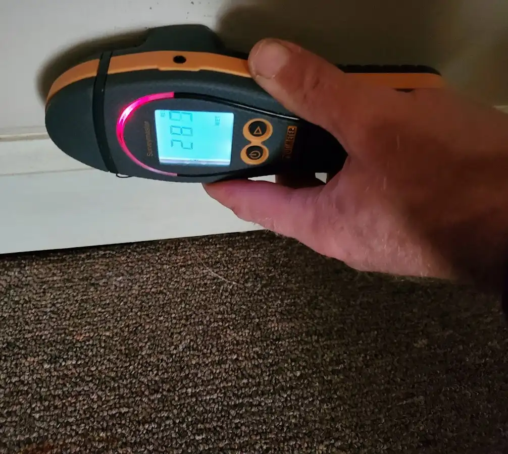 Moisture detection at baseboard during Sewage Cleanup & Sanitation in Center Point